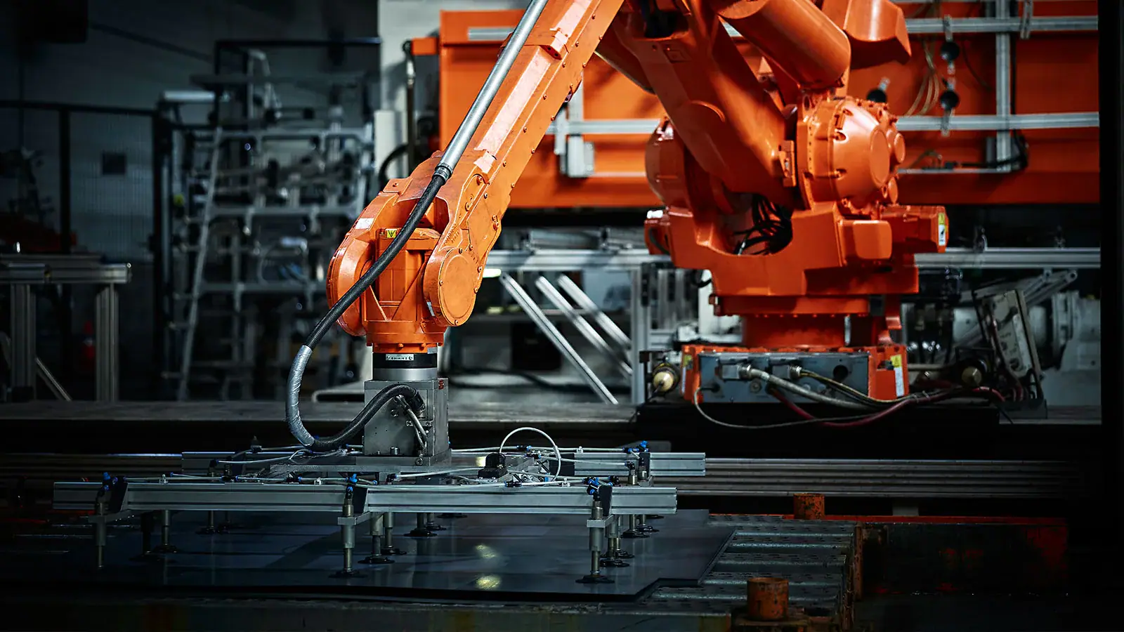 Robotic arms on an automated industrial production line.